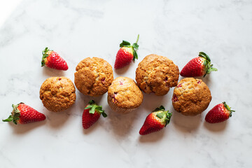 Strawberry muffins on a marble background. Top view. - 535918867