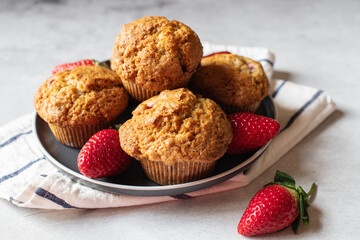 Strawberry muffins served in a plate on a marble background. Close up. - 535918869