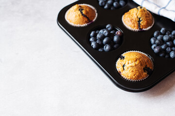 Blueberry muffins on a marble background. Copy space. - 535918876