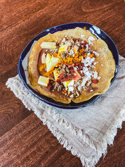 vegan dessert crepe with apples, coconut, and sauce