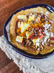 crepe with apples, nuts, and fruit