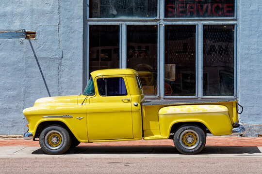 Victor, CO - July 9, 2022: Yellow 50s era Chevrolet 3100 pickup truck