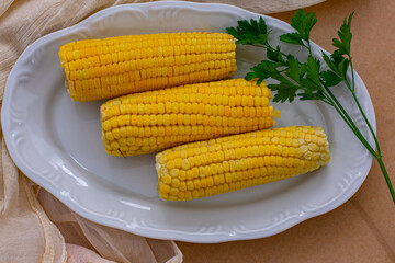 cooked corn on the cob on a plate