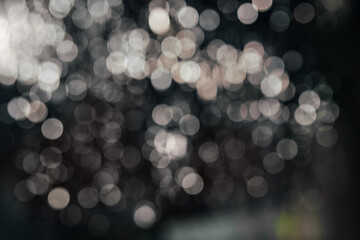 Black abstract bokeh background. Black Friday, Cyber Monday or Christmas holidays