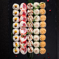 tasty sushi on the black background