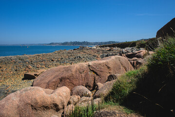 Monolithic blocks of pink granite in the Cotes d'Armor in Brittany, France. Pink granite coast