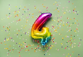 Colorful balloon number 4 on light green background. New Year of birthday concept