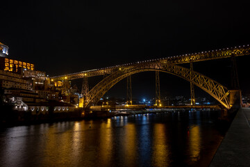Fototapeta na wymiar Night view of Dom Luis I bridge and the Douro River, in the city of Porto old town, Portugal.