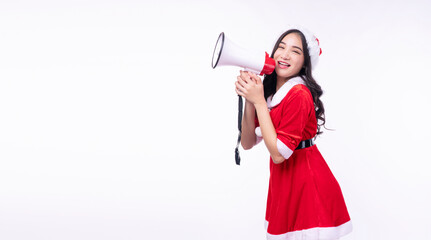 Excited asian woman Santa Claus dress Christmas hat using megaphone shouting announce shopping sale over isolated white background.Santa Claus girl holding red speaker screaming present discounts sale