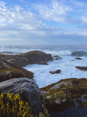 Waves hitting the rocky Maine coastline in the morning