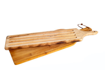 wooden cutting board with grooves for blood and fat on a white background. kitchen utensils concept