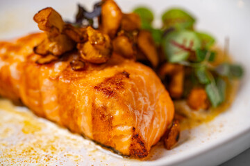 grilled salmon with mushrooms on a plate