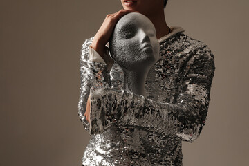 Fashion male model posing in the studio wearing sequins top. Horizontal mock-up.