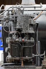 Black old engine of an old vintage steam train in Martel, France