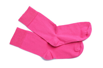 Pair of pink socks on white background, top view