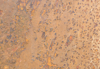 Rustic stone, stone wall erosion texture or grunge stone texture with rust color used for web design and wallpaper background.