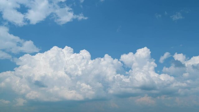 Summer cumulonimbus clouds. White clouds nature cloudscape background. Beautiful cumulonimbus cloud moving. Timelapse.