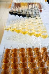 set of glasses with whiskey, champagne and wine on the table