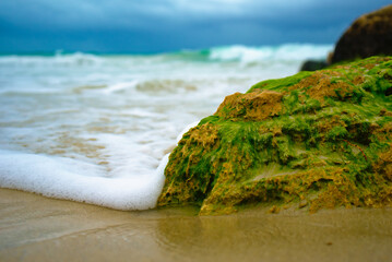 ocean waves foam over rock macro 29