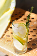 Summer refreshing lemonade drink on wicker bench