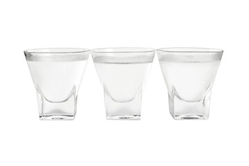 Vodka in shot glasses on white background