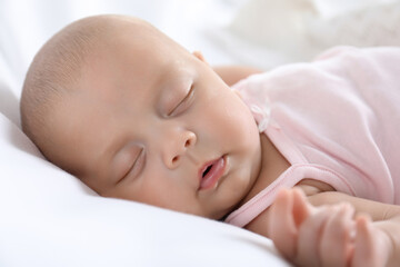 Cute little baby sleeping on bed, closeup