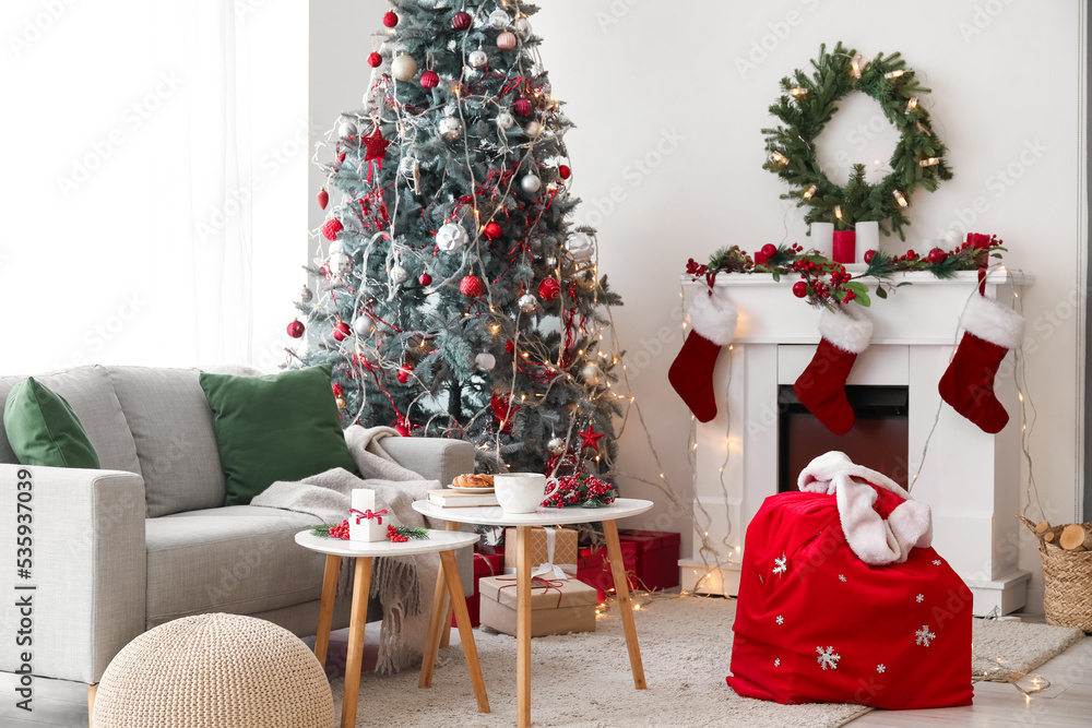 Poster interior of living room with santa bag, fireplace and christmas tree