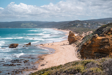 view of the coast line with water on one side and mountains on the other