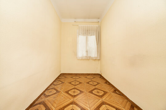 Empty Room In Old Apartment Built With Modest Qualities, Brown Tiles And Curtained Windows