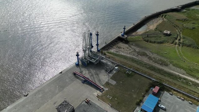 Aerial view of a gas and oil unloading terminal with pipeline, future site of an LNG terminal