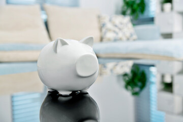 White piggy bank on living room table