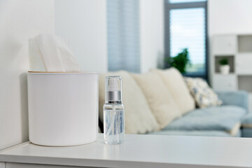 Hand sanitizer and tissue on the table