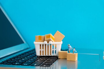 Mother and son and boxes on laptop keyboard