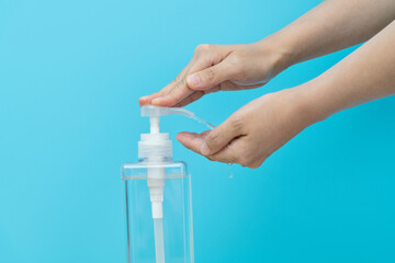 Woman hands using hand sanitizer gel