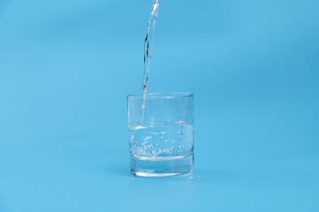 Pouring water into the glass
