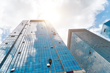 Modern office buildings under cloudy sky