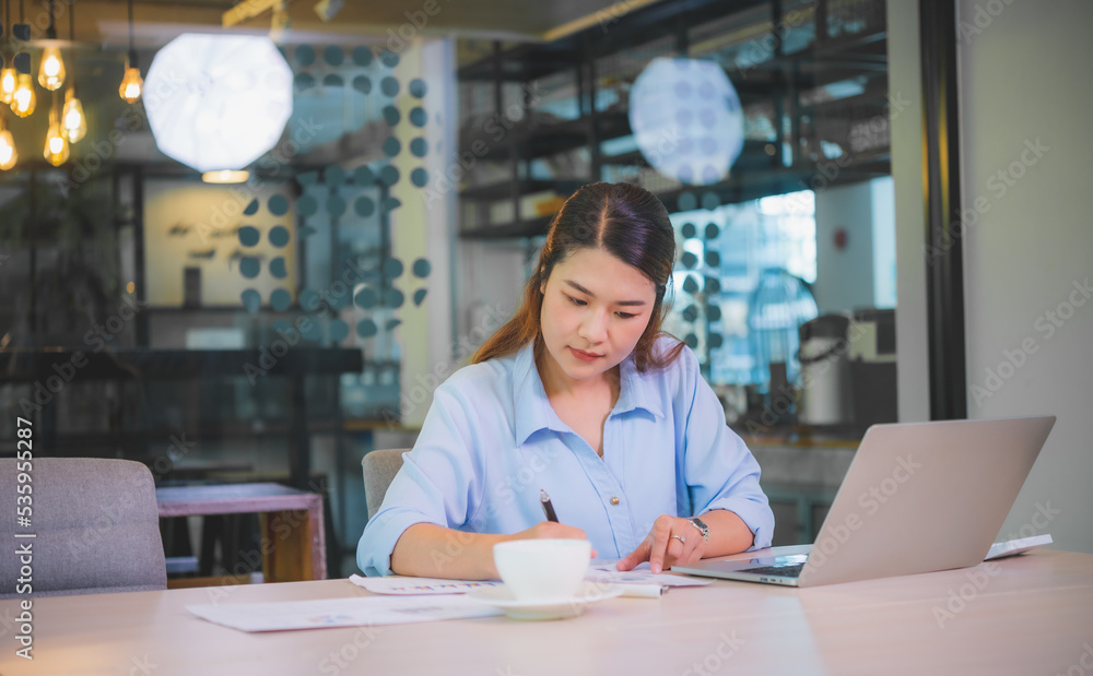 Canvas Prints Asian business woman working using  laptop for do math finance on wooden desk, tax, accounting, statistics and analytical research concept