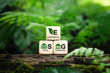 ESG concept of environmental, social and governance.words ESG on a woodblock on beautiful green background, It is an idea for sustainable organizational development. ​World environment day - obrazy, fototapety, plakaty