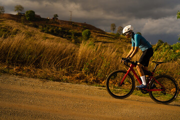 Fototapeta premium Cyclists practicing on gravel roads.