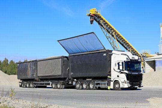 Closing The Trailer Roof For Transport After Loading Foam Glass Aggregate Onto Scania 560R Pulled Trailer At Production Plant. Forssa, Finland. 