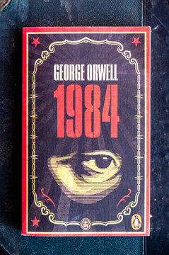 Calgary, Alberta - September 29, 2022: Cover of George Orwell's 1984 on rustic background.