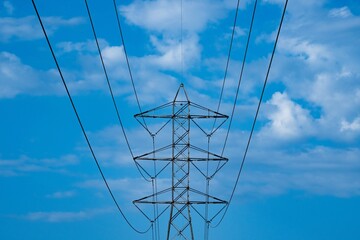 Power lines with clouds in the background