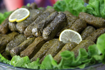 Turkish appetizer food ‘Stuffed Grape Leaves' (Turkish: Yaprak Sarma) on the dinner plate.