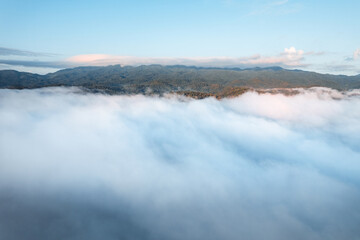 fog with mountains and light in the morning