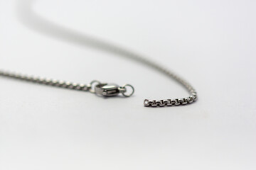 silver stainless steel necklace with hooks on a white background