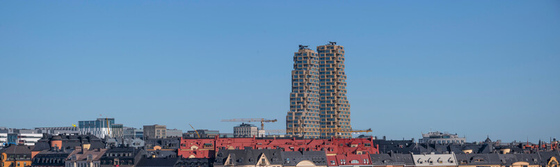 Panorama view of the skyscrapers Norra Tornen and roof tops of the district Vasastan a sunny autumn...