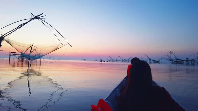 Beautiful sunrise at Pakpra canal,Scenic view of Pakpra early in the beautiful morning. vintage bamboo fish trap machine.