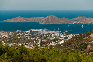 Bay in the city of Bodrum from the height of the suburban highway. Port and resort real estate.