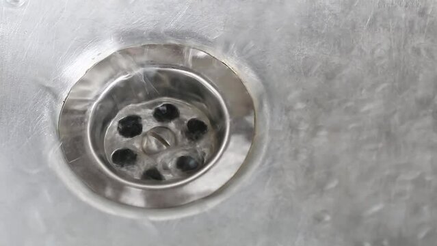 draining water at sink