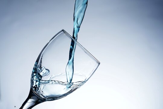 image of pouring water into a glass